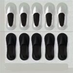5 white socks at the top and 5 black socks at the bottom of the image