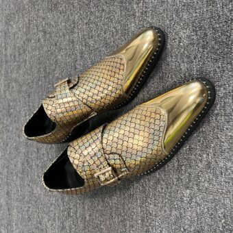 Men's pointed gold loafers with grey background