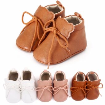 4 pairs of brown, white and pink lace-up moccasins laid flat