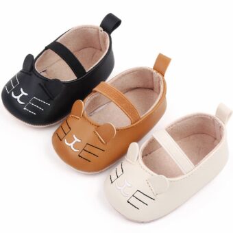 3 baby moccasins with kitten pattern in white, brown and black, lined up diagonally on a white background