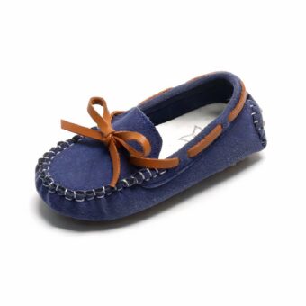 Synthetic suede moccasins with brown bow for boys with white background