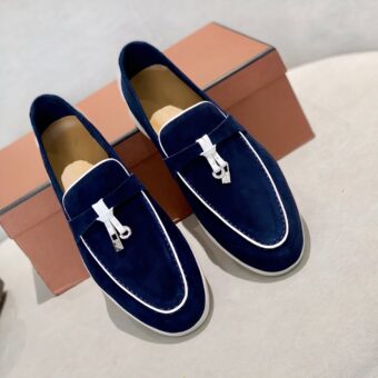 Elegantly detailed tassel loafers for men with an orange shoebox bottom