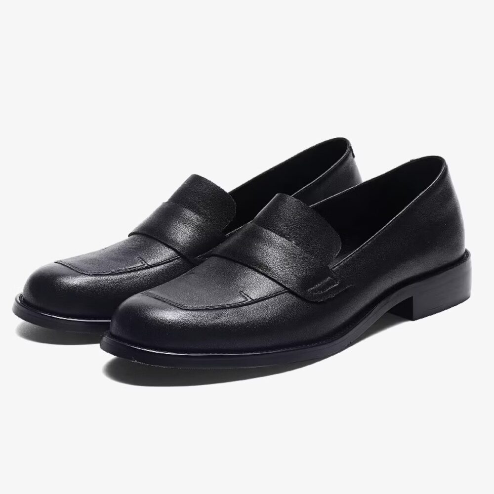 Classic elegant leather loafers for women on a white background