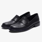 Classic elegant leather loafers for women on a white background