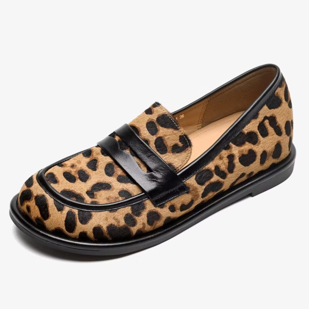 Single soft leopard leather loafer on a white background
