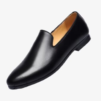 A minimalist black loafer for men on a plain white background