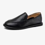 Single slipper-style loafers for women on a white background