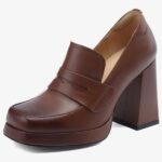 A brown heeled leather loafer for women on a white background
