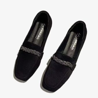 Elegant suede loafers with rhinestone chains on a white background