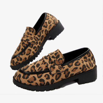 Leopard heeled loafers with black sole on a white background