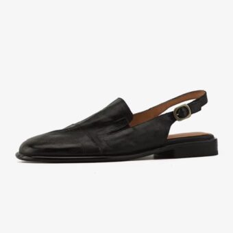 Single leather loafer mule for women on a white background