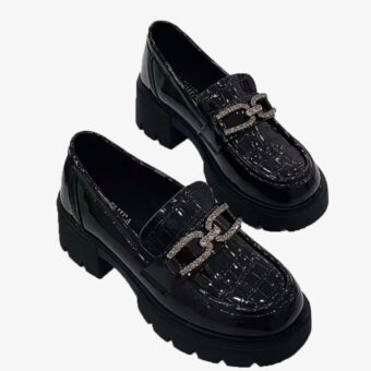 Black crocodile-effect platform loafers with rhinestone chain on a white background