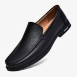 A black casual leather loafer for men on a plain white background